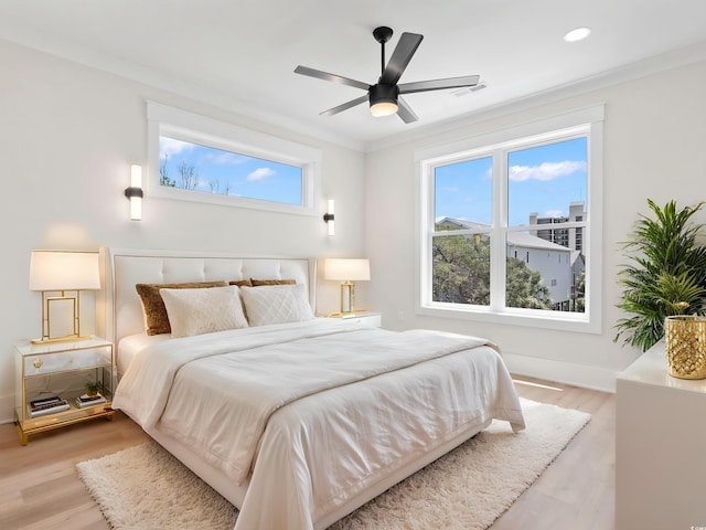 4617 Hedrick St, North Myrtle Beach, SC 29582 - bedroom featuring light wood-style flooring, recessed lighting, crown molding, and ceiling fan