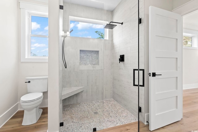 4617 Hedrick St, North Myrtle Beach, SC 29582 - bathroom featuring a shower stall and wood finished floors
