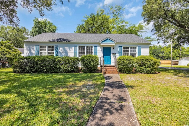 1155 Palmetto St, Georgetown, SC 29440 - view of front facade with a front yard and a shingled roof