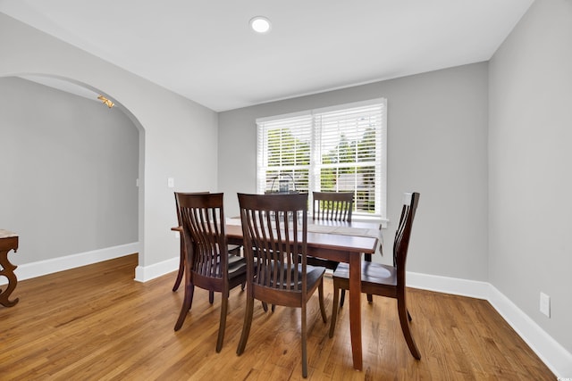 1155 Palmetto St, Georgetown, SC 29440 - dining area with arched walkways, light wood-style floors, and recessed lighting