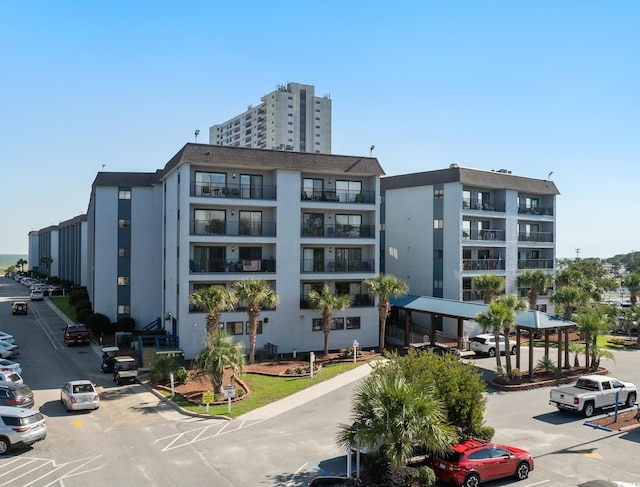5905 S Kings Hwy Unit 242B, Myrtle Beach, SC 29575 - view of apartment building / complex featuring uncovered parking