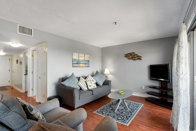 5905 S Kings Hwy Unit 242B, Myrtle Beach, SC 29575 - living room with wood finished floors, baseboards, and a textured ceiling