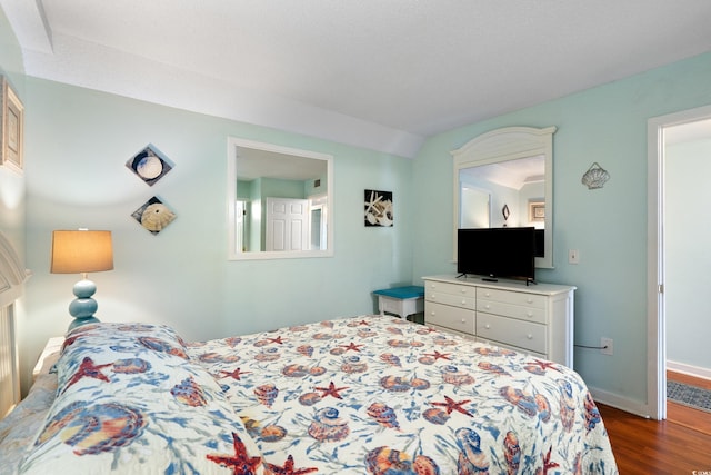 5905 S Kings Hwy Unit 242B, Myrtle Beach, SC 29575 - bedroom featuring dark wood-type flooring and baseboards
