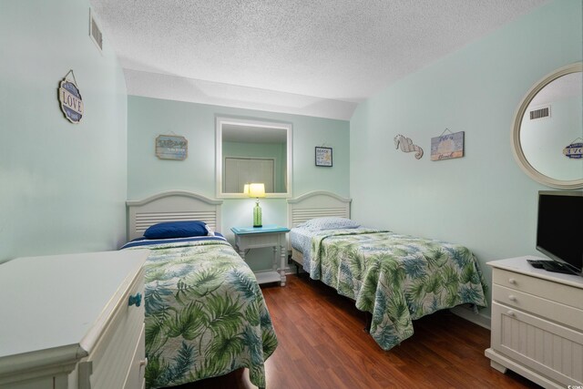 5905 S Kings Hwy Unit 242B, Myrtle Beach, SC 29575 - bedroom with wood finished floors and a textured ceiling