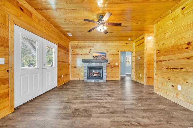 1039 Forest Dr, Conway, SC 29526 - unfurnished living room featuring wooden walls, wooden ceiling, a fireplace, ceiling fan, and wood finished floors