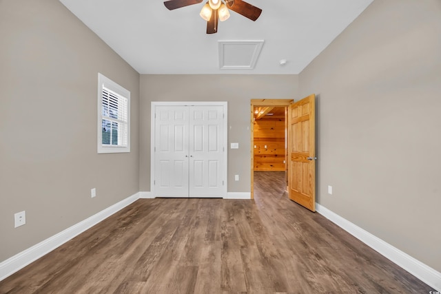 1039 Forest Dr, Conway, SC 29526 - unfurnished bedroom featuring a closet, wood finished floors, attic access, and a ceiling fan