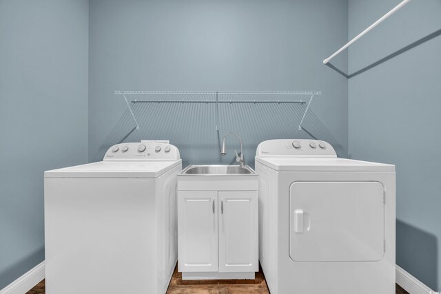 1039 Forest Dr, Conway, SC 29526 - laundry room featuring washing machine and dryer, cabinet space, and dark wood-type flooring