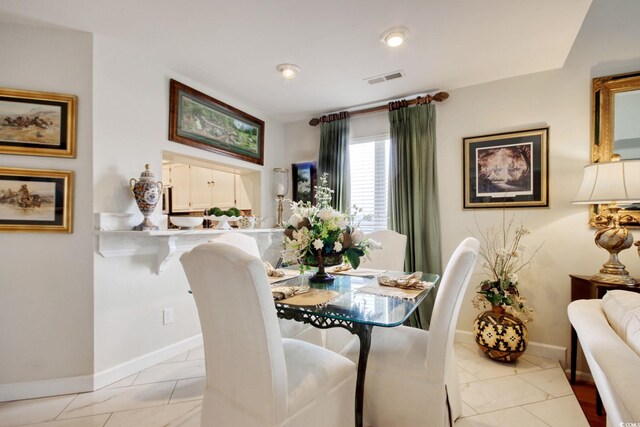 4396 Baldwin Ave Unit 1, Little River, SC 29566 - dining room featuring baseboards