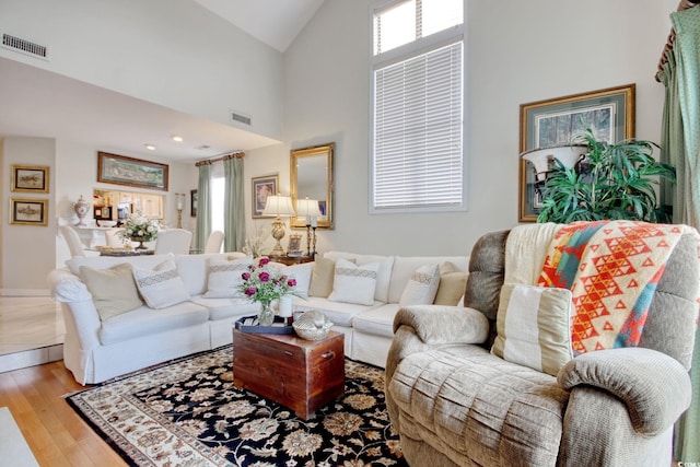 4396 Baldwin Ave Unit 1, Little River, SC 29566 - living room with hardwood / wood-style floors, high vaulted ceiling, and baseboards