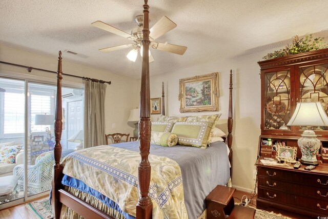 4396 Baldwin Ave Unit 1, Little River, SC 29566 - bedroom featuring access to outside, wood finished floors, a textured ceiling, ceiling fan, and baseboards