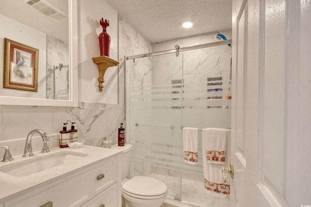 4396 Baldwin Ave Unit 1, Little River, SC 29566 - full bath with a marble finish shower, toilet, vanity, a textured ceiling, and tile walls