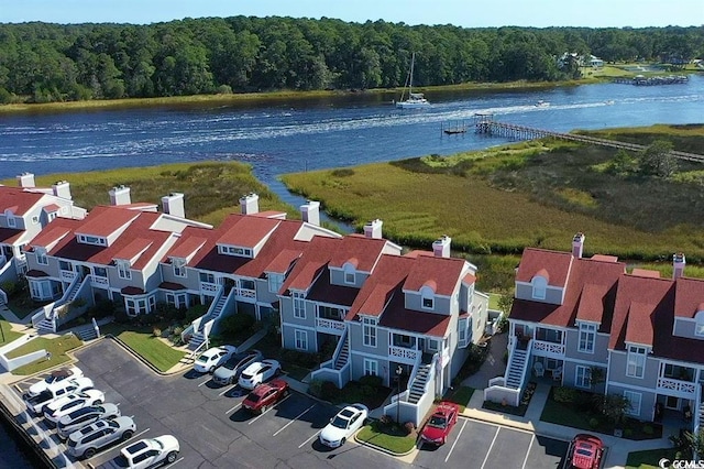 4396 Baldwin Ave Unit 1, Little River, SC 29566 - drone / aerial view of a large body of water and a heavily wooded area
