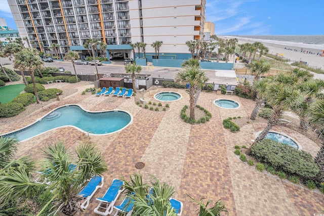 1605 S Ocean Blvd Unit 204, Myrtle Beach, SC 29577 - community pool featuring a hot tub and a patio