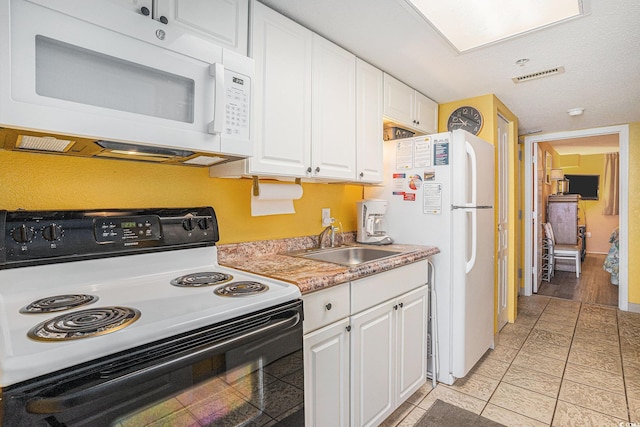 2801 S Ocean Blvd Unit 535, North Myrtle Beach, SC 29582 - kitchen with white appliances, a sink, white cabinets, and light countertops