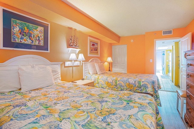 2801 S Ocean Blvd Unit 535, North Myrtle Beach, SC 29582 - bedroom featuring wood finished floors and a closet