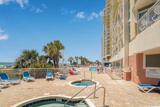 2801 S Ocean Blvd Unit 535, North Myrtle Beach, SC 29582 - community pool featuring a hot tub and a patio