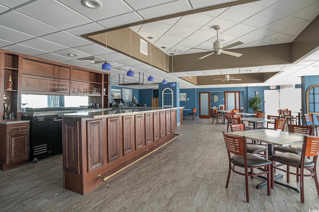2801 S Ocean Blvd Unit 535, North Myrtle Beach, SC 29582 - dining space featuring a paneled ceiling, wood finished floors, and ceiling fan