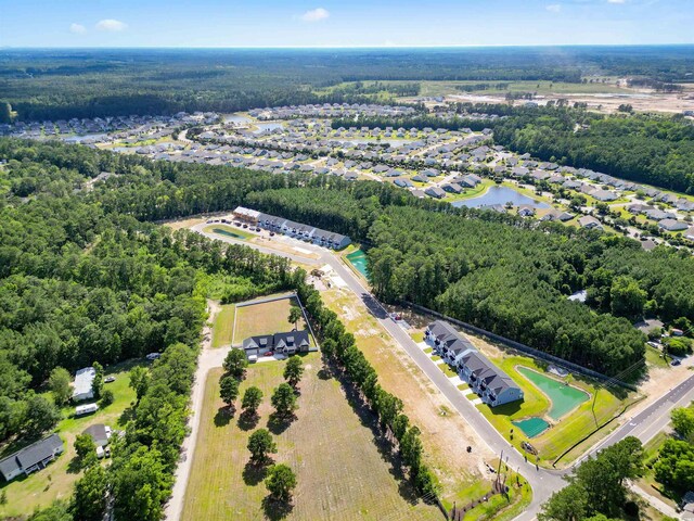 786 NW Palm Frond Way Unit 51, Calabash, NC 28467 - bird's eye view of a heavily wooded area and a nearby body of water