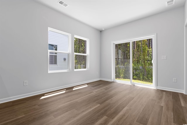 786 NW Palm Frond Way Unit 51, Calabash, NC 28467 - spare room with wood finished floors and baseboards