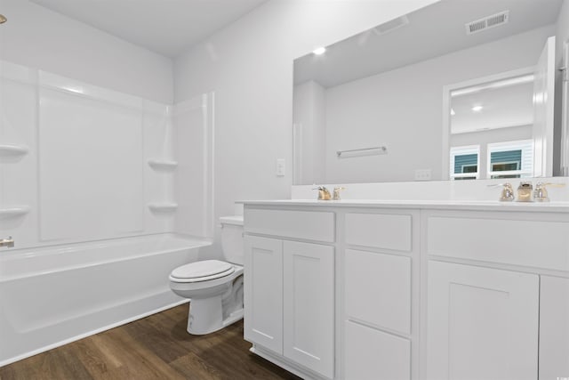 786 NW Palm Frond Way Unit 51, Calabash, NC 28467 - full bath featuring toilet, double vanity, wood finished floors, and bathing tub / shower combination