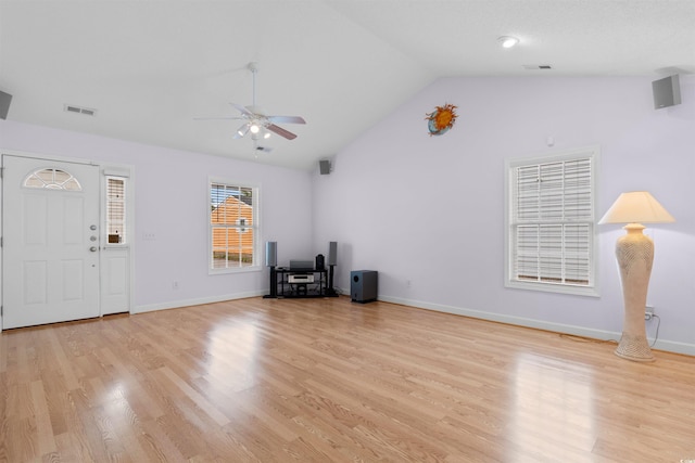 613B 3rd Ave S, North Myrtle Beach, SC 29582 - unfurnished living room with lofted ceiling, a ceiling fan, light wood-style flooring, and baseboards