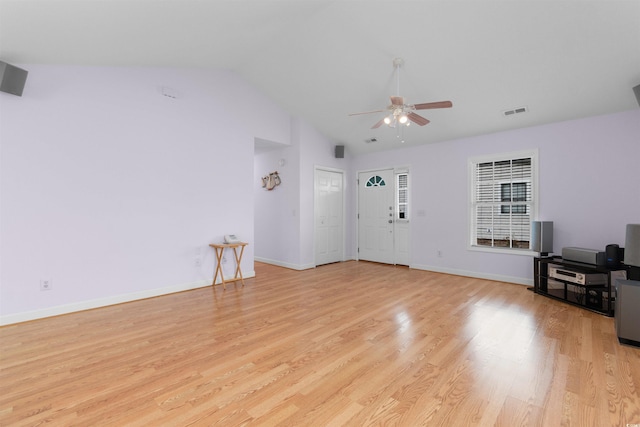 613B 3rd Ave S, North Myrtle Beach, SC 29582 - unfurnished living room featuring ceiling fan, lofted ceiling, wood finished floors, and baseboards