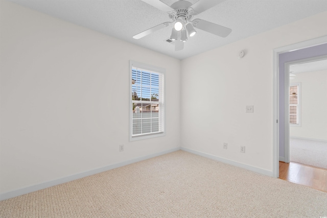 613B 3rd Ave S, North Myrtle Beach, SC 29582 - empty room featuring carpet, baseboards, and a ceiling fan