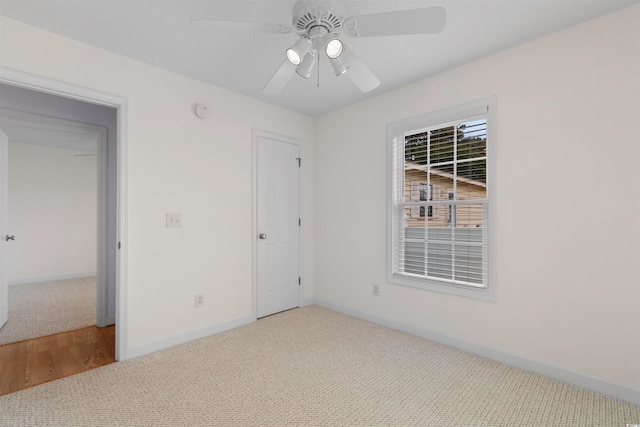613B 3rd Ave S, North Myrtle Beach, SC 29582 - unfurnished room featuring carpet, a ceiling fan, and baseboards