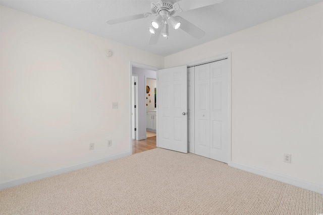 613B 3rd Ave S, North Myrtle Beach, SC 29582 - unfurnished bedroom featuring light carpet, baseboards, a closet, and a ceiling fan