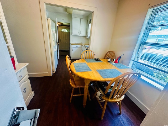 8 Raymond St, Andrews, SC 29510 - dining space featuring dark wood-style flooring and baseboards