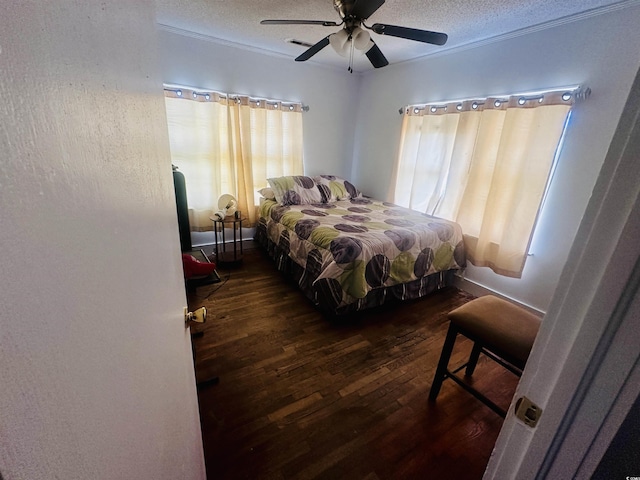 8 Raymond St, Andrews, SC 29510 - bedroom featuring dark wood finished floors, a textured ceiling, and a ceiling fan