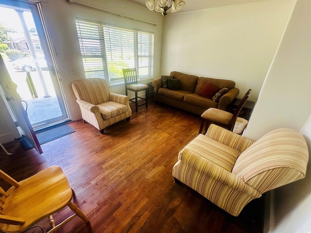 8 Raymond St, Andrews, SC 29510 - living area featuring wood finished floors, healthy amount of natural light, and a chandelier