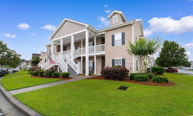 411 Mahogany Dr Unit 101, Murrells Inlet, SC 29576 - view of front of home with a porch, a front lawn, and stairs