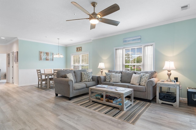 411 Mahogany Dr Unit 101, Murrells Inlet, SC 29576 - living area featuring a chandelier, healthy amount of natural light, light wood finished floors, a ceiling fan, and ornamental molding