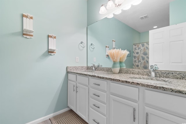 411 Mahogany Dr Unit 101, Murrells Inlet, SC 29576 - full bathroom with double vanity, curtained shower, and baseboards