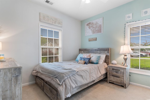 411 Mahogany Dr Unit 101, Murrells Inlet, SC 29576 - bedroom featuring light colored carpet, multiple windows, and baseboards