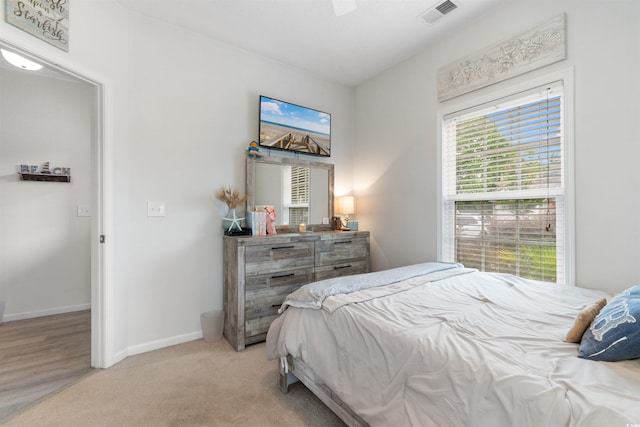 411 Mahogany Dr Unit 101, Murrells Inlet, SC 29576 - bedroom with light colored carpet, baseboards, and a ceiling fan