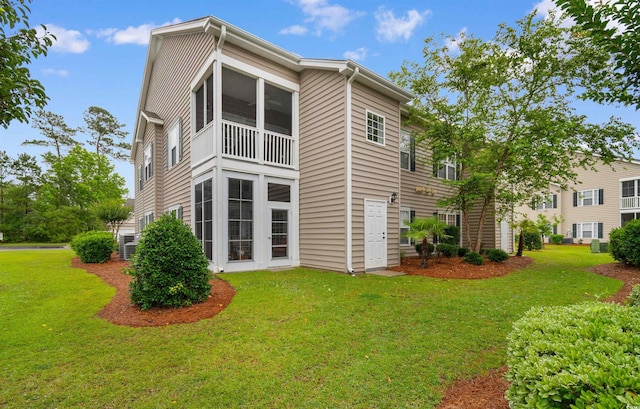 411 Mahogany Dr Unit 101, Murrells Inlet, SC 29576 - back of house with a lawn and cooling unit