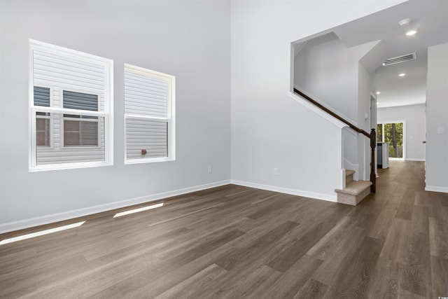 776 NW Palm Frond Way Unit 55, Calabash, NC 28467 - spare room featuring wood finished floors, stairs, baseboards, and recessed lighting