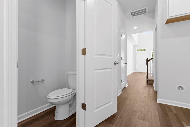 776 NW Palm Frond Way Unit 55, Calabash, NC 28467 - bathroom featuring wood finished floors, baseboards, and toilet