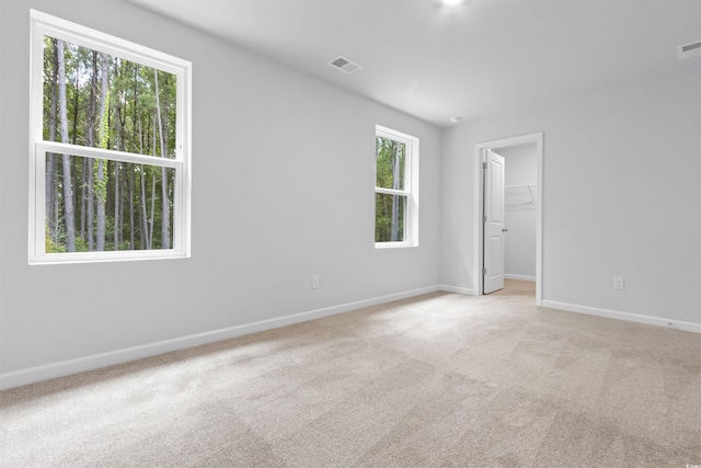 776 NW Palm Frond Way Unit 55, Calabash, NC 28467 - empty room with carpet and baseboards