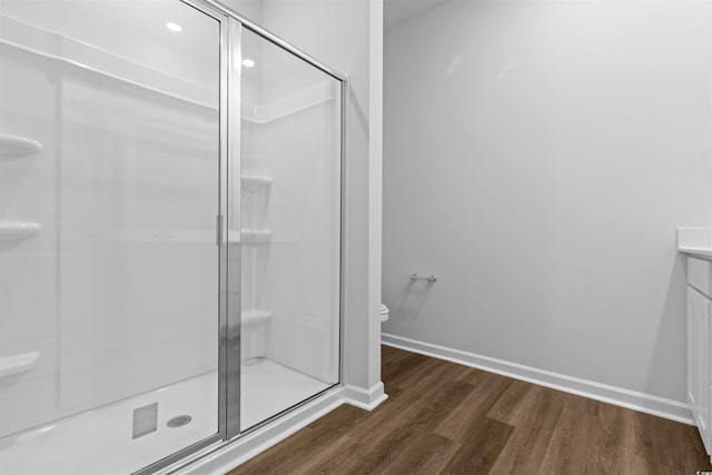 776 NW Palm Frond Way Unit 55, Calabash, NC 28467 - full bath with toilet, wood finished floors, a stall shower, vanity, and baseboards