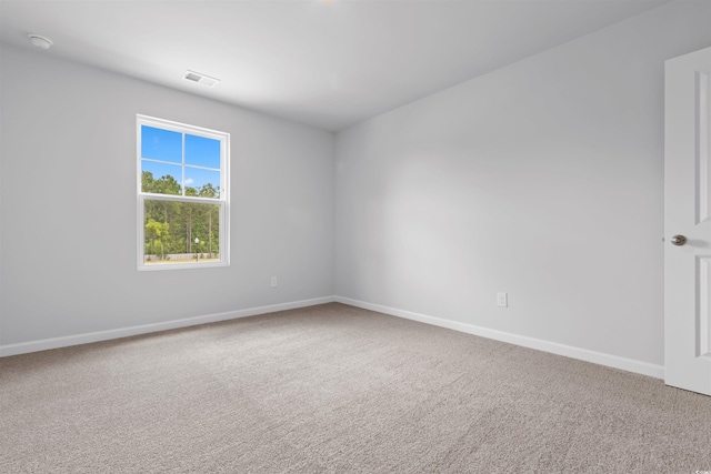776 NW Palm Frond Way Unit 55, Calabash, NC 28467 - carpeted spare room featuring baseboards and a smoke detector