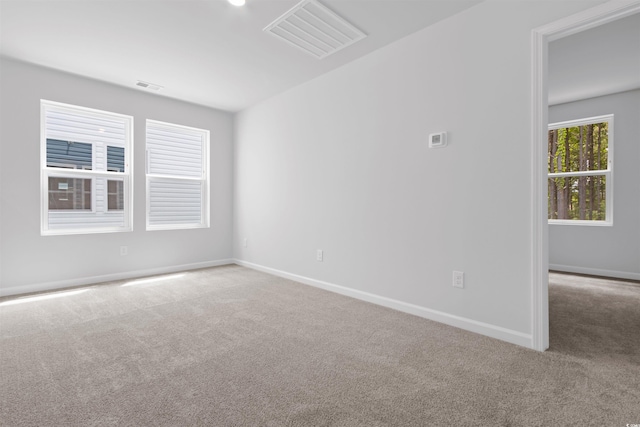 776 NW Palm Frond Way Unit 55, Calabash, NC 28467 - spare room featuring carpet and baseboards