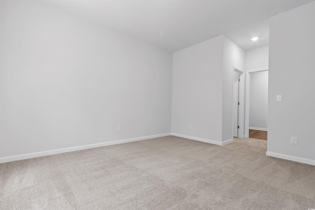 776 NW Palm Frond Way Unit 55, Calabash, NC 28467 - spare room with carpet, baseboards, and recessed lighting