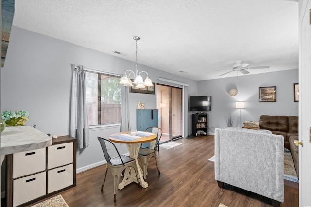 614 15th Ave S Unit 41, Surfside Beach, SC 29575 - dining space featuring a chandelier, dark wood-type flooring, ceiling fan, and a textured ceiling