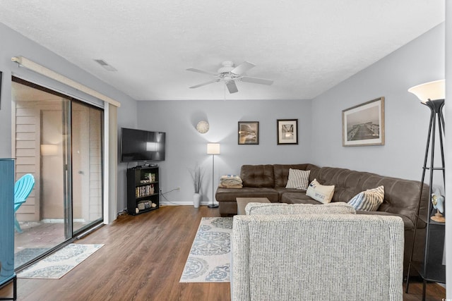 614 15th Ave S Unit 41, Surfside Beach, SC 29575 - living area with wood finished floors, a ceiling fan, and a textured ceiling