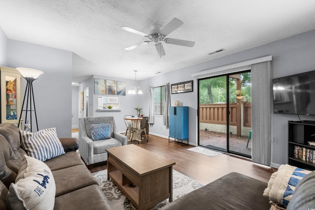 614 15th Ave S Unit 41, Surfside Beach, SC 29575 - living area with wood finished floors, ceiling fan, a textured ceiling, and a chandelier