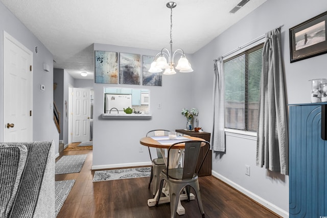 614 15th Ave S Unit 41, Surfside Beach, SC 29575 - dining area featuring wood finished floors and a chandelier