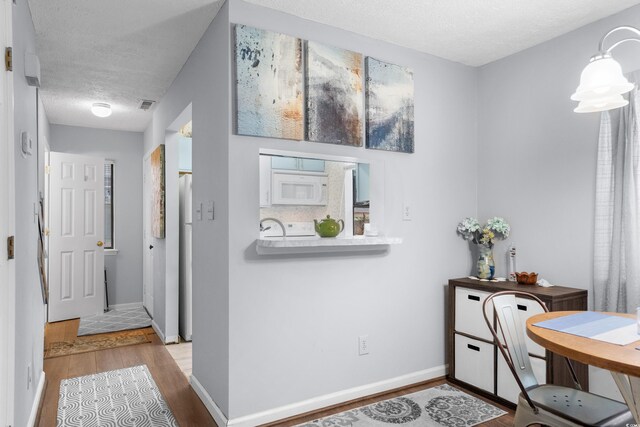 614 15th Ave S Unit 41, Surfside Beach, SC 29575 - hallway with a textured ceiling and wood finished floors